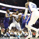 Philadelphia 76ers and Cameroon’s Joel Embiid (21) drives to the ball to the basket as Charlotte Hornets and DR Congo’s Bismack Biyombo (8) and Devonte Graham (4) defend.